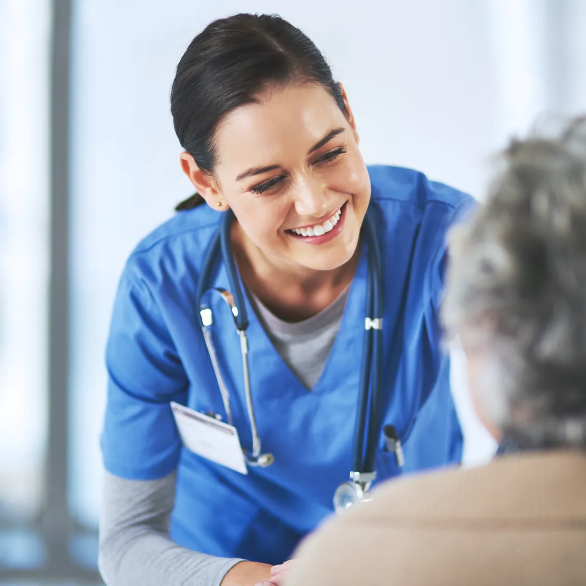 Registered nurse reviewing CEU compliance status on phone