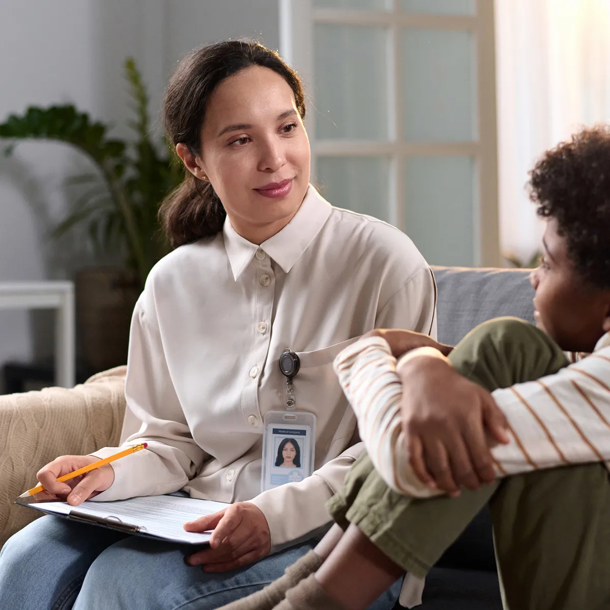 Social worker chatting with a child